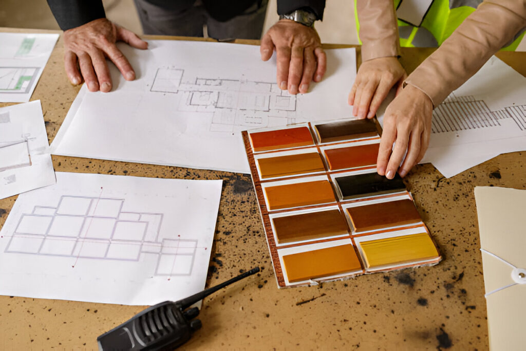 A group of hardwood floor contractors discussing a project.